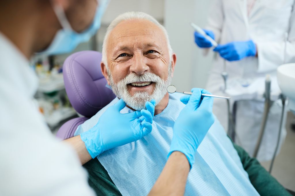 Patient Smiling Sitting in Dental Chair